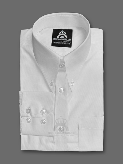 White dress shirt with decorative buttons on a gray background