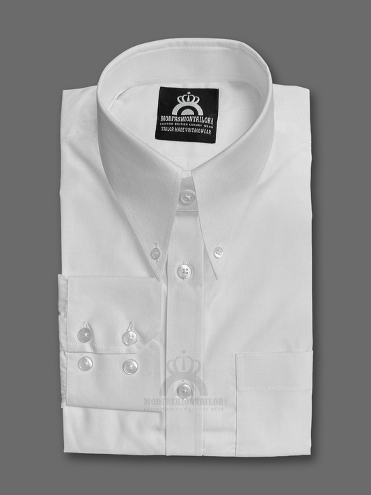 White dress shirt with decorative buttons on a gray background